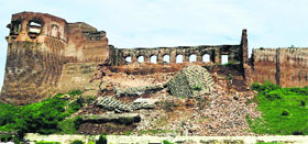 The collapsed wall of the historic Bahu Fort in Jammu.