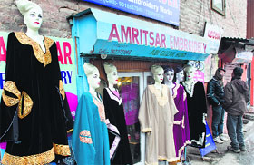 Mannequins wearing pherans displayed outside a shop in Srinagar.
