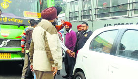 Commuters argue with a bus driver after it rammed into a stationary car at Bhai Bala Chowk in Ludhiana.
