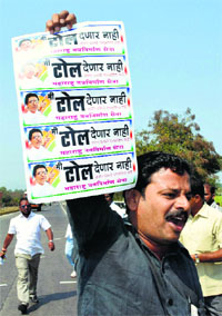 An MNS worker protests against toll tax on the Pune-Bengaluru National Highway