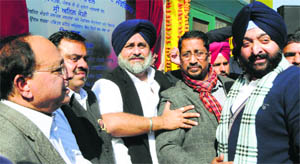 Deputy CM Sukhbir Badal with party leaders at the inauguration of the City Bus Service in Amritsar on Tuesday.