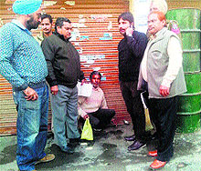 MC officials seal an oil depot at Gurbax Nagar in Amritsar on Wednesday