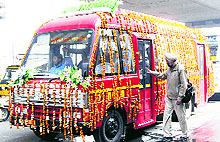 Passengers board a city bus