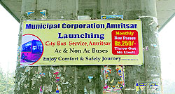 defying the outdoor advertisement policy, the civic body pasted the city bus information posters on the pillars of the elevated road on the Amritsar-Jalandhar GT road