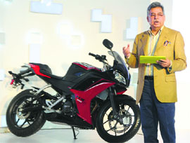 Pawan Munjal, CEO, Hero MotoCorp, poses with 250cc sportsbike in New Delhi on Wednesday
