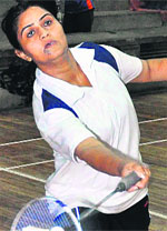 A player returns a shot during the inter-college badminton championship being held at Panjab University. Tribune photo