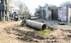 A road in a pathetic condition at Balongi village in Mohali. The residents were hoping that the village would be included in the MC limits and it would usher in development. Tribune photo: Vicky Gharu 
