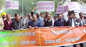The BJP MLAs  marching towards the Lieutenant Governors house in New Delhi on Wednesday. 