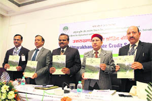 Dignitaries release a souvenir at the Uttarakhand State Credit Seminar of Nabard in Dehradun on Tuesday.