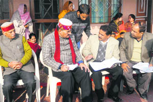 MLA Ganesh Joshi discusses the drinking water project with officials concerned at Bhatta village in Mussoorie on Wednesday.