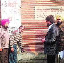 MC officials seal a shop in Amritsar on Thursday