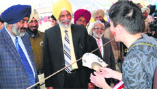 Punjab Minister Surjit Singh Rakhra takes a round during an exhibition at the function in Bathinda on Thursday. Tribune photos: Pawan Sharma