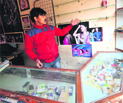 The owner shows his ransacked shop at Dhanas on Thursday.
