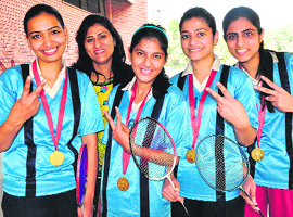 The badminton team of the Dev Samaj College of Education in a jubilant mood after winning the championship at Panjab University.