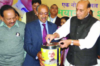BJP national president Rajnath Singh along with Delhi party president Vijay Goel and Leader of the Opposition in Delhi Assembly Harsh Vardhan, launches the partys election campaign in Delhi on Thursday. Tribune Photo