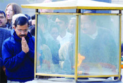Chief Minister Arvind Kejriwal prays at Rajghat, the memorial of Mahatma Gandhi, on his death anniversary in New Delhi on Thursday. Tribune Photo: Mukesh Aggarwal