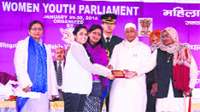 Governor Jagannath Pahadia felicitates youth parliamentarians at BPS Women University, Khanpur Kalan, on Thursday.