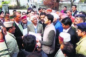 Oustees of the BSL project apprise Mandi DC Devesh Kumar in Sundernagar on Wednesday