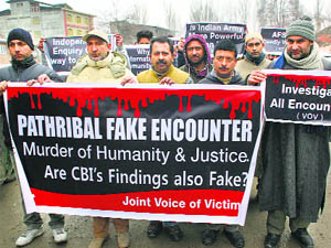 A human rights group on Thursday protests against the closure of Pathribal case by the Army, in Srinagar.
