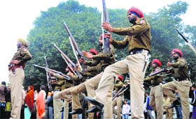 Punjab Police personnel pay homage to the Father of the Nation on the Martyrs' Day at the office of the Deputy Commissioner in Ludhiana on Thursday