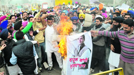 Activists of the Youth Akali Dal burn an effigy of the AICC vice president Rahul Gandhi in Bathinda on Friday.