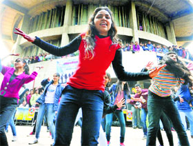 Students of Panjab University dance during a flash mob organised as part of the VIMARSH-2014 fest at Student Centre on Friday.