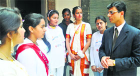 Dr Sachin Gupta interacts with students at the Government Polytechnic College for Women in Chandigarh on Friday.