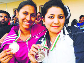 Aashima (left) and Priyanka with their medals at Lal Bahadur Shastri Stadium in Hyderabad.
