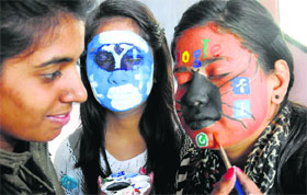 Students take part in a face-painting competition at the Dev Samaj College for Women, Sector 45, Chandigarh.