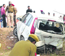 Police officials examine the site of the accident in Landran village, Mohali, on Friday.
