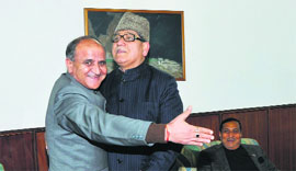 Deputy Chief Minister Tara Chand greets Minister for Higher Education Mohammad Akbar Lone ahead of a Cabinet Sub-Committee meeting in Jammu on Friday.