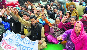 Members of the Erstwhile Doda Migrant Committee stage a protest in Jammu on Friday.