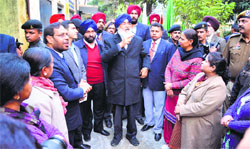 Chief Minister Parkash Singh Badal interacts with the staff of Government Senior Secondary School, Cemetery Road, in Ludhiana on Friday. Photo: Inderjeet Verma