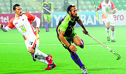 Delhi Waveriders Sardar Singh in action during his teams 5-0 win over Kalinga Lancers in New Delhi on Thursday