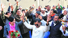 Suppoters of Harish Rawat celebrate at the Bijapur guest house in Dehradun on Saturday after the Haridwar MP was made Chief Minister of the state.