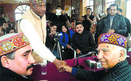 Senior BJP leader Shanta Kumar welcomes former MLA Des Raj to the party.