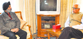 Commodore Dalbir Singh Sodhi with Governor NN Vohra at Raj Bhawan in Jammu on Saturday.