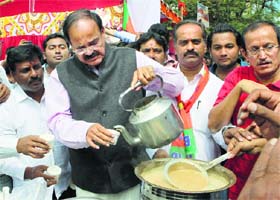 BJP leader Venkaiah Naidu serves Modi tea to people in Bengaluru on Saturday