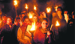 Guest faculty lecturers hold a torchlight procession outside Government Rajindra College in Bathinda on Saturday. Tribune photo: Pawan Sharma