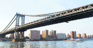 Brooklyn Bridge, completed in 1883, connects the boroughs of Manhattan @@and Brooklyn by spanning the East River.