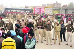 Police personnel deployed at the grain market to tackle the dharna by teachers
