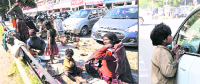 A family of beggars getting ready for the day at Sector 22; and (right) a child seeks alms from a motorist at a traffic light point of Sector 21-22 in Chandigarh. 