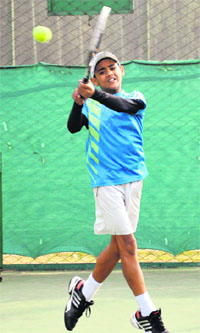 Rishab Sharda returns a shot during the ongoing CLTA-AITA Talent Series Tennis Tournament at the CLTA grounds in Sector 10, Chandigarh, on Sunday