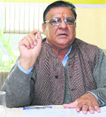 President of the local unit of Janta Dal (U), Surinder Bhardwaj, addresses mediapersons in Chandigarh on Sunday