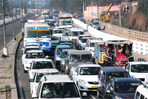 Long queues of vehicles stuck in a traffic jam on the Chandigarh-Delhi highway at Dera Bassi railway flyover on Sunday. 