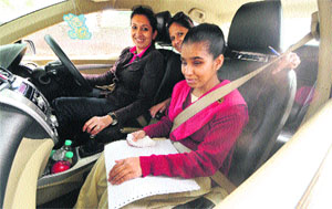 A visually-impaired student along with her navigator participates in the Blind Man Car Rally in Chandigarh on Sunday.