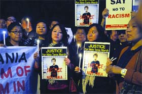 People of northeast take part in a candlelight vigil at Jantar Mantar demanding justice for Nido Taniam in New Delhi on Sunday