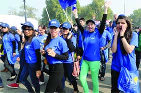 People participate in a walk to fight against cancer, organised by Can support, at Rajpath in New Delhi on Sunday