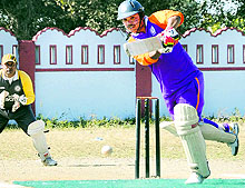 A batsman plays a shot during the Uttarakhand Youth Twenty-20 Cricket Tournament at Survey Stadium in Dehradun on Sunday