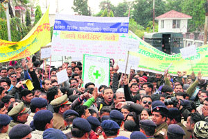 Unemployed diploma pharmacists stage a protest outside the Secretariat in Dehradun on Monday. 